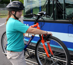 Load bike into tire slots in bike rack