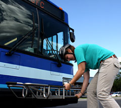 Lower the bike rack at the front of the bus